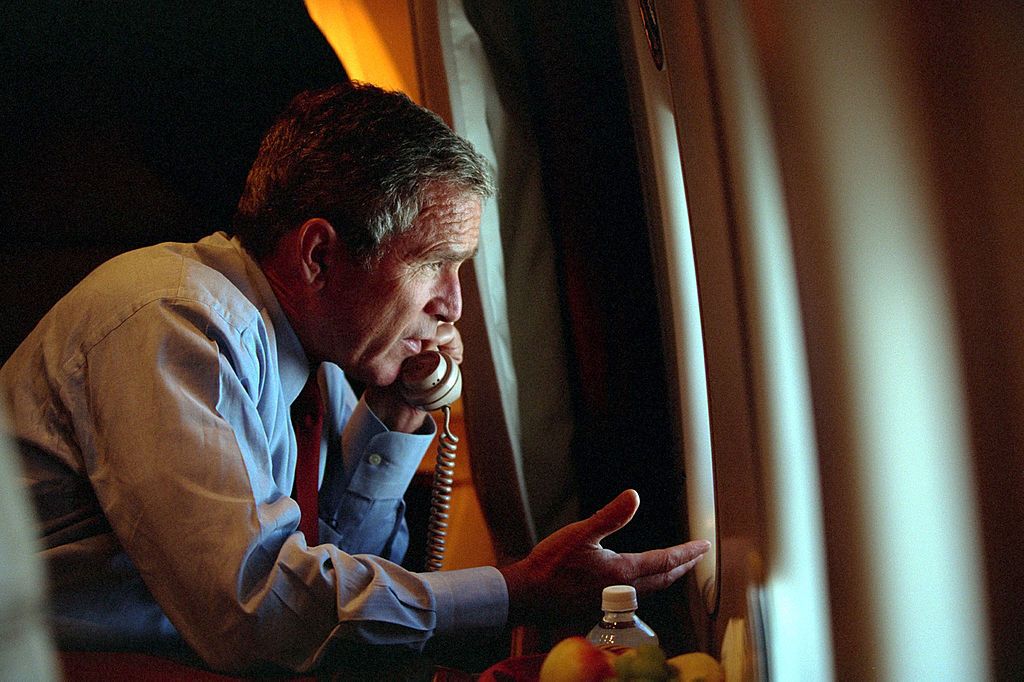 U.S. president George W. Bush speaks to vice president Dick Cheney by phone aboard Air Force One on September 11, 2001, after departing Offutt Air Force Base in Nebraska. (Photo by Eric Draper/The White House/Getty Images)