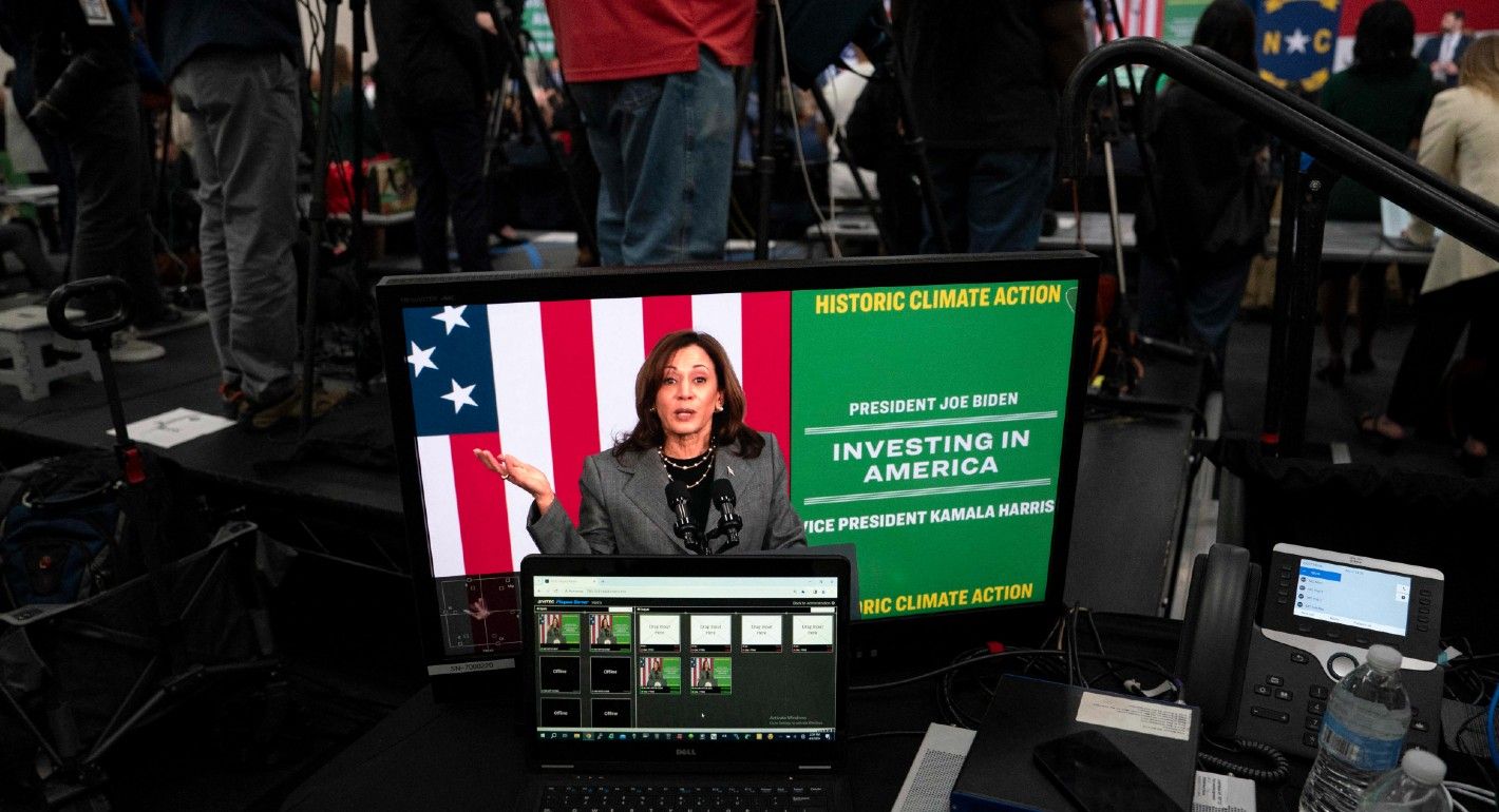 US Vice President Kamala Harris is seen on a screen as she speaks on the administration's investments in climate action at Naomi Drenan Recreational Center in Charlotte, North Carolina