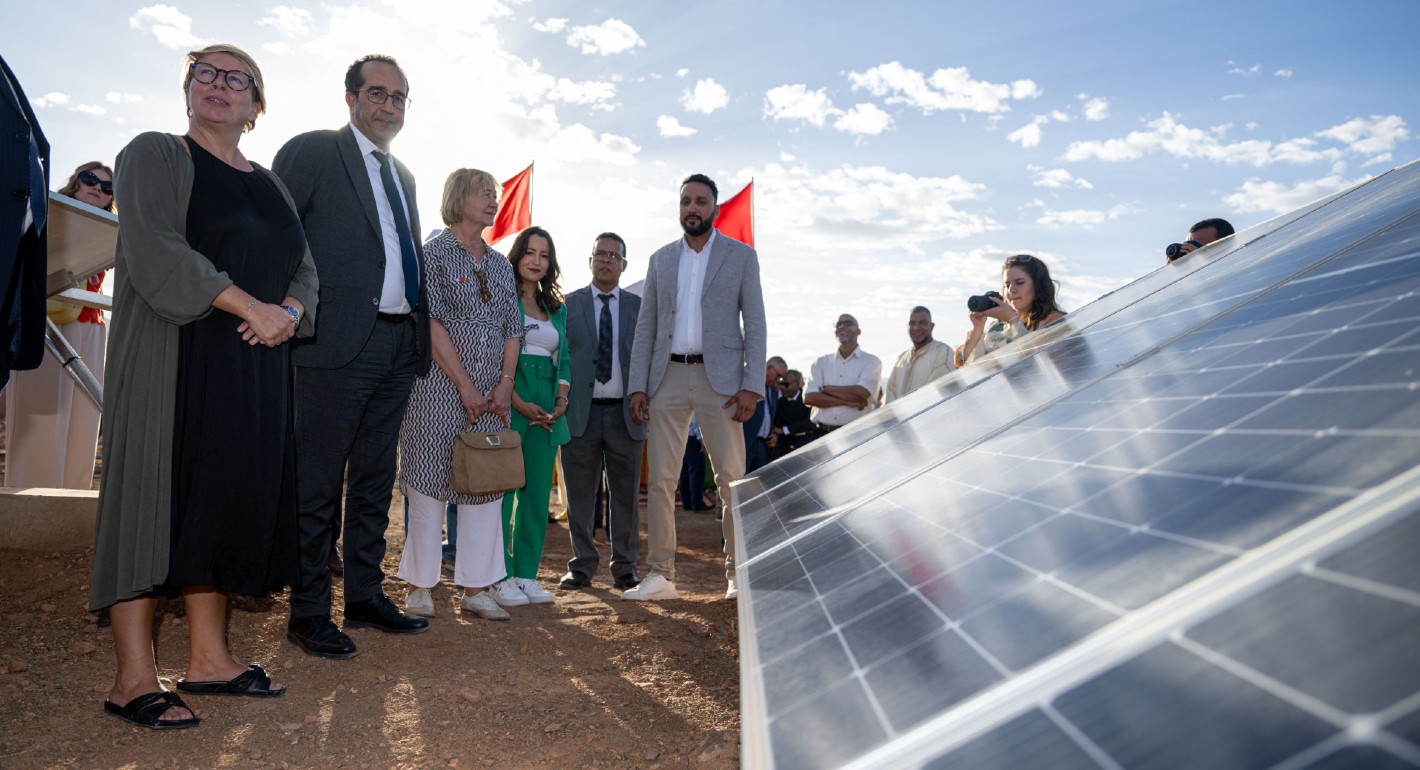 Minister for Development Cooperation and Metropolitan Policy Caroline Gennez (L) visits a solar power project during a visit to the packaging unit 