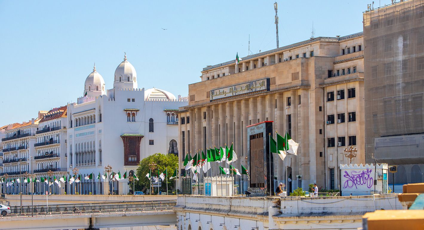 Algeria city street with flags