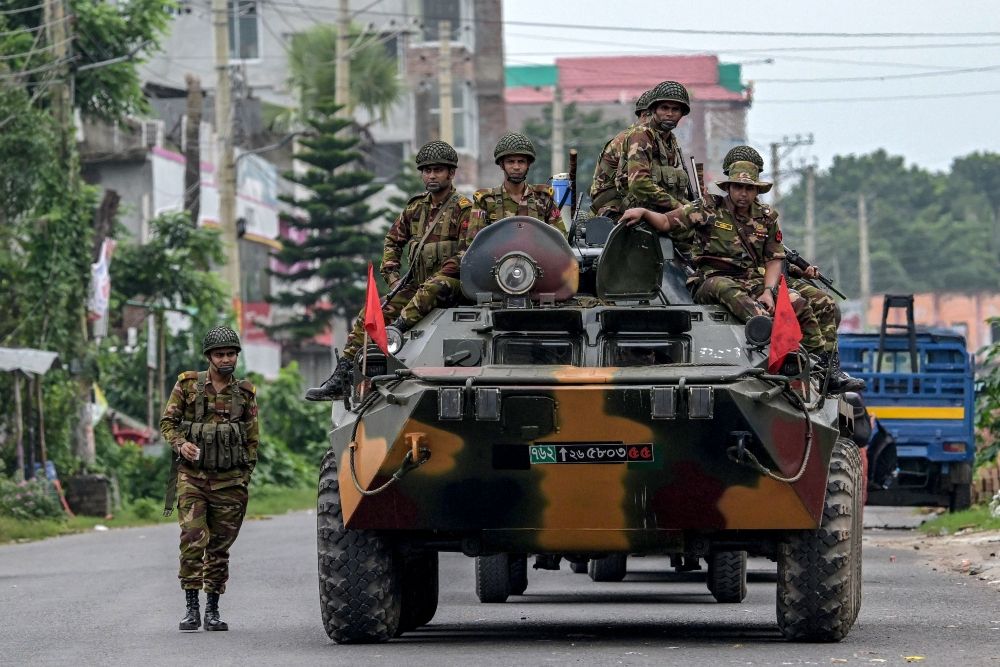 Soldiers sitting on a tank