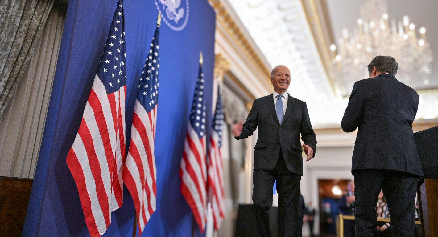 Biden on stage smiling