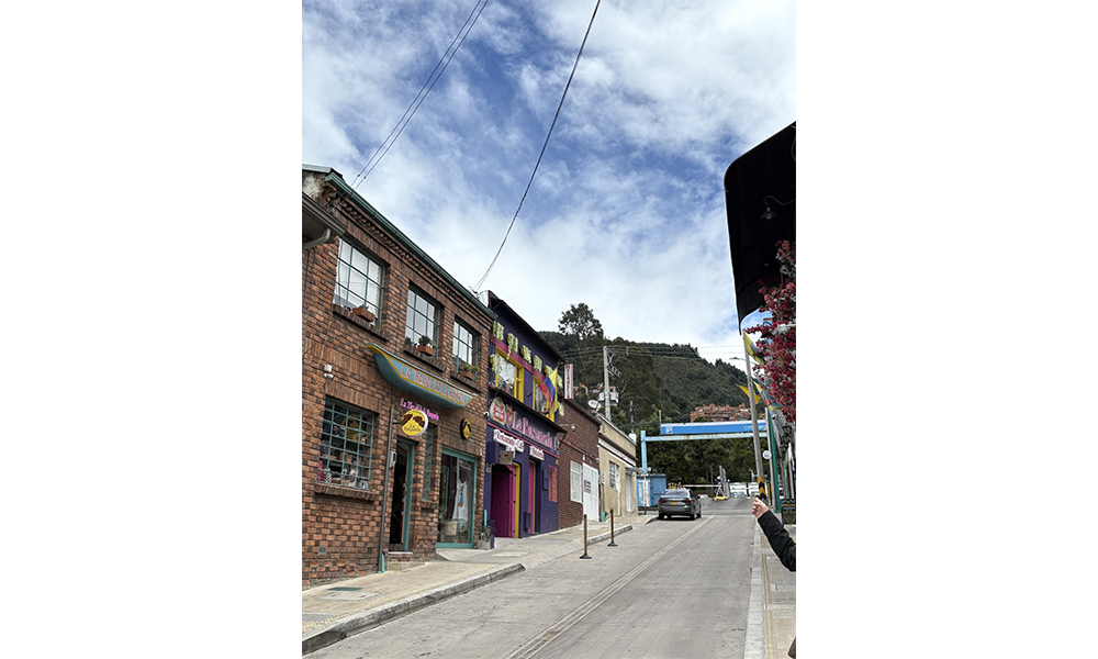city street with rowhouse-style buildings