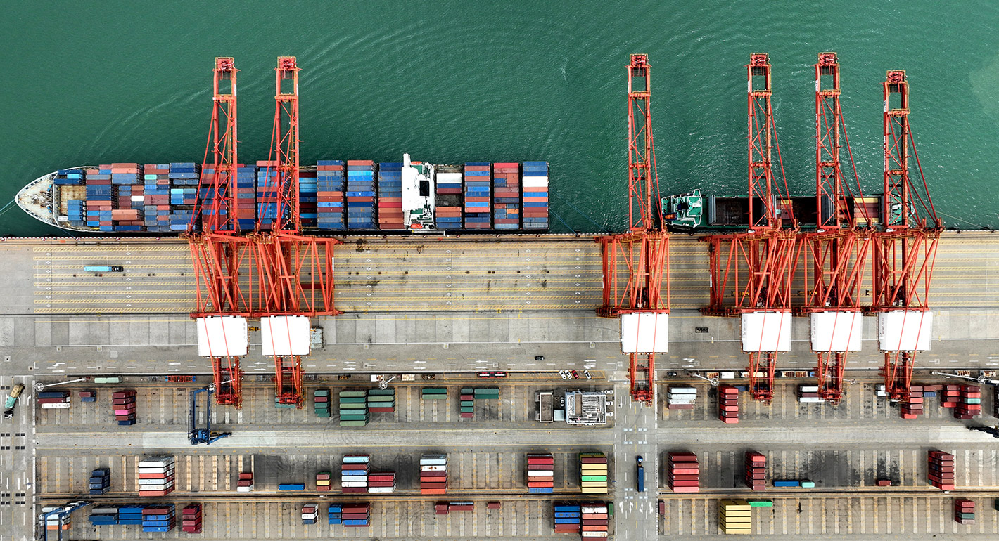 his aerial photo taken on July 16, 2023 shows cranes and shipping containers at Lianyungang port in China's eastern Jiangsu province. 