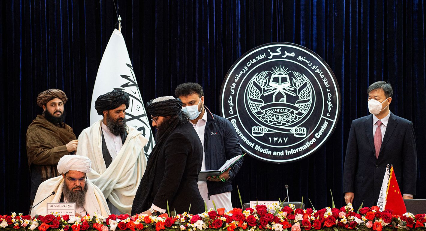 Acting minister of mines and petroleum Shahabuddin Dilawar (L sitting), Afghanistan's acting first deputy prime minister Abdul Ghani Baradar (2L) and China's ambassador to Afghanistan Wang Yu (R) attend a press conference to announce an oil extraction contract with a Chinese company in Kabul on January 5, 2023.