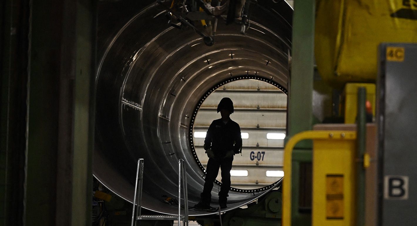 A wind turbine factory worker is seen as US President Joe Biden tours CS Wind, the largest wind tower manufacturer in the world, in Pueblo, Colorado, on November 29, 2023.