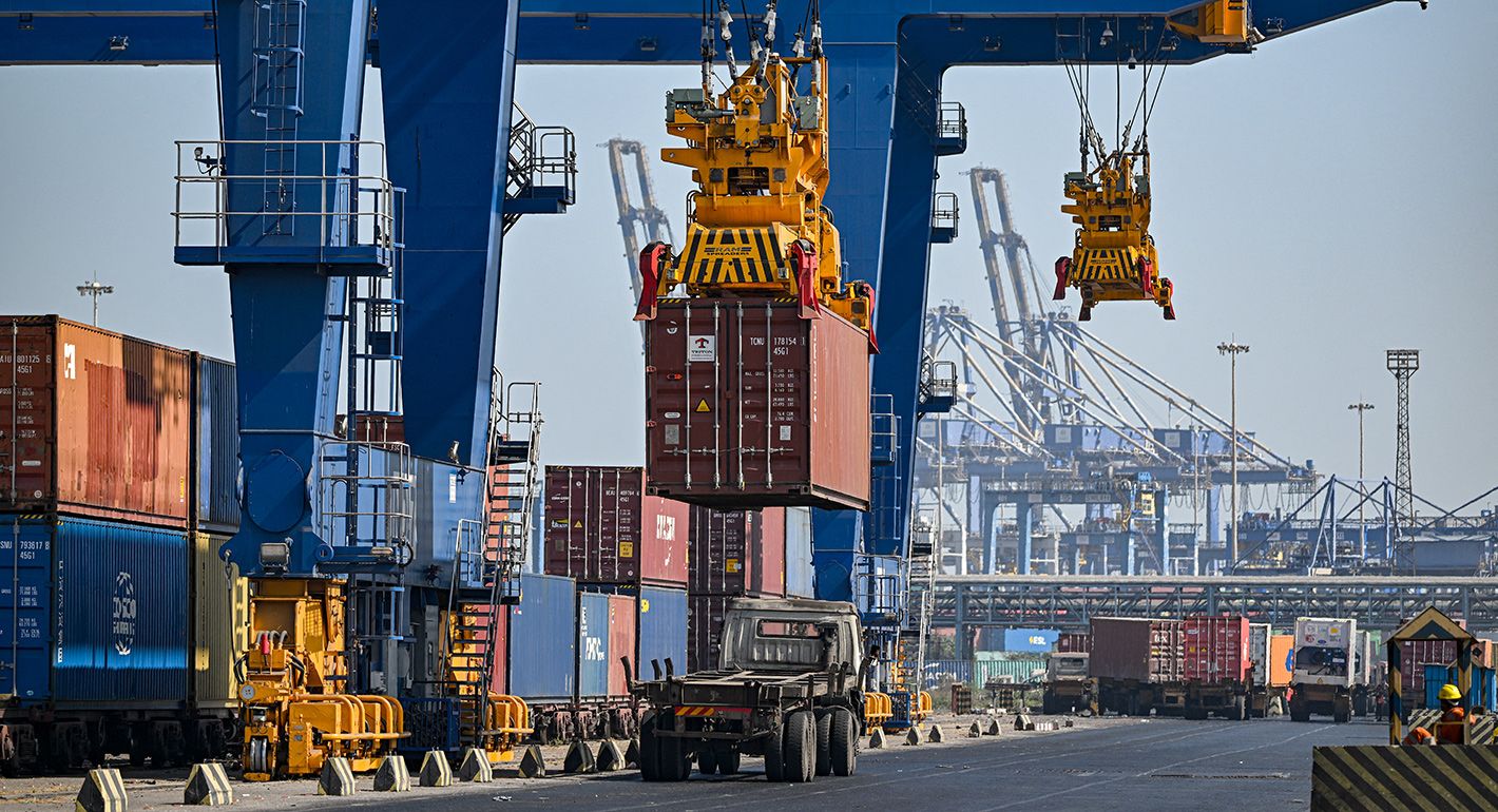 This photograph taken on January 11, 2024, shows a crane loading a cargo container on a truck at the Adani Group owned Mundra Port in Mundra, deep in the desert along the border with Pakistan