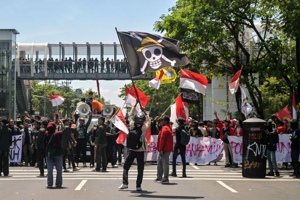 People waving flags in the street