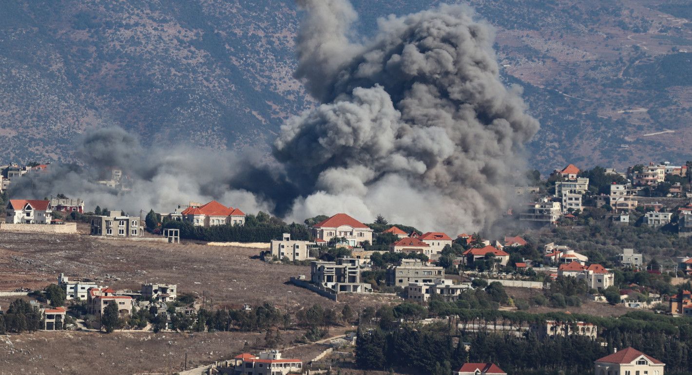 Smoke rising from among houses