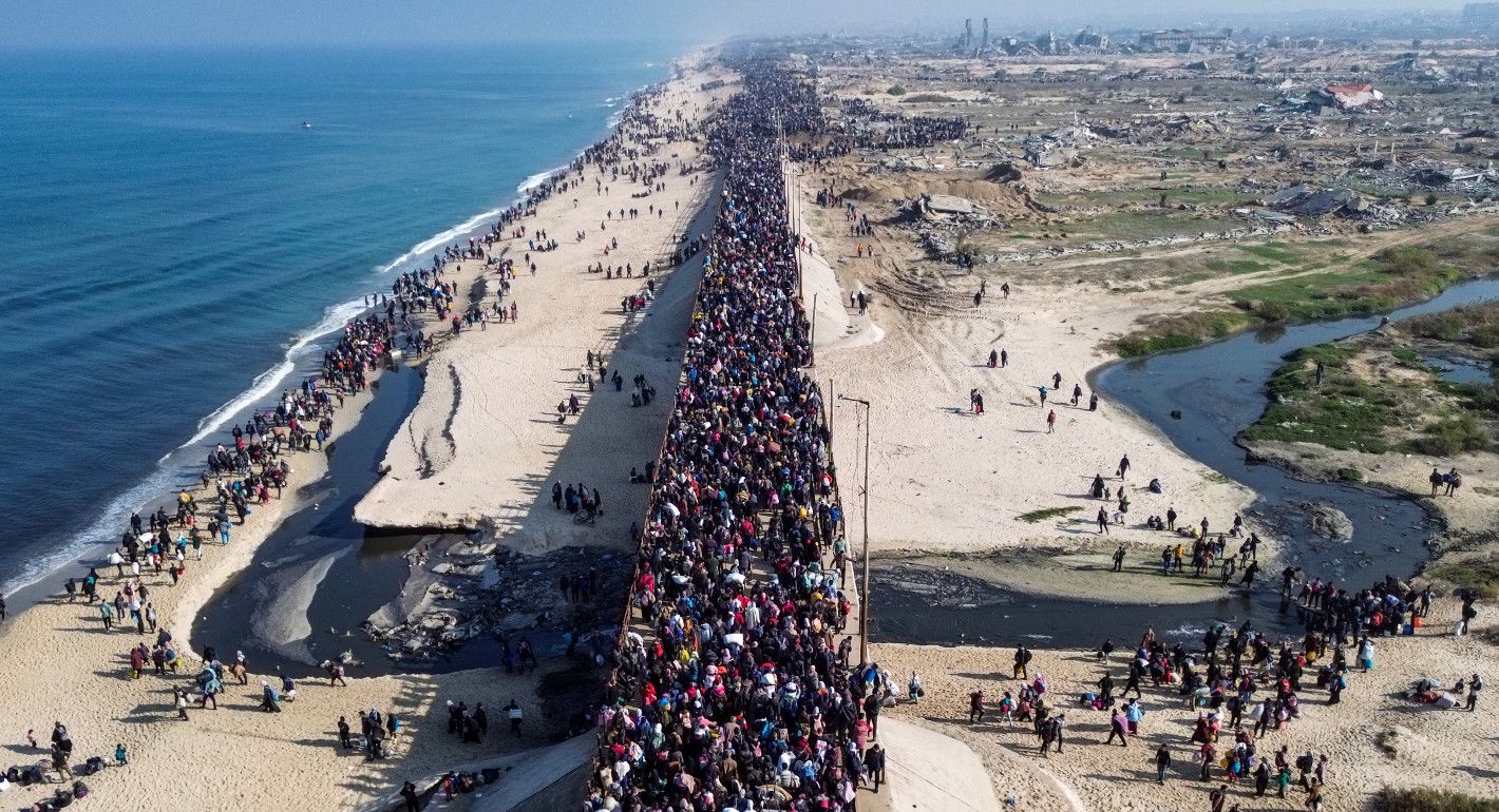 Aerial view of a huge crowd of people walking along a street