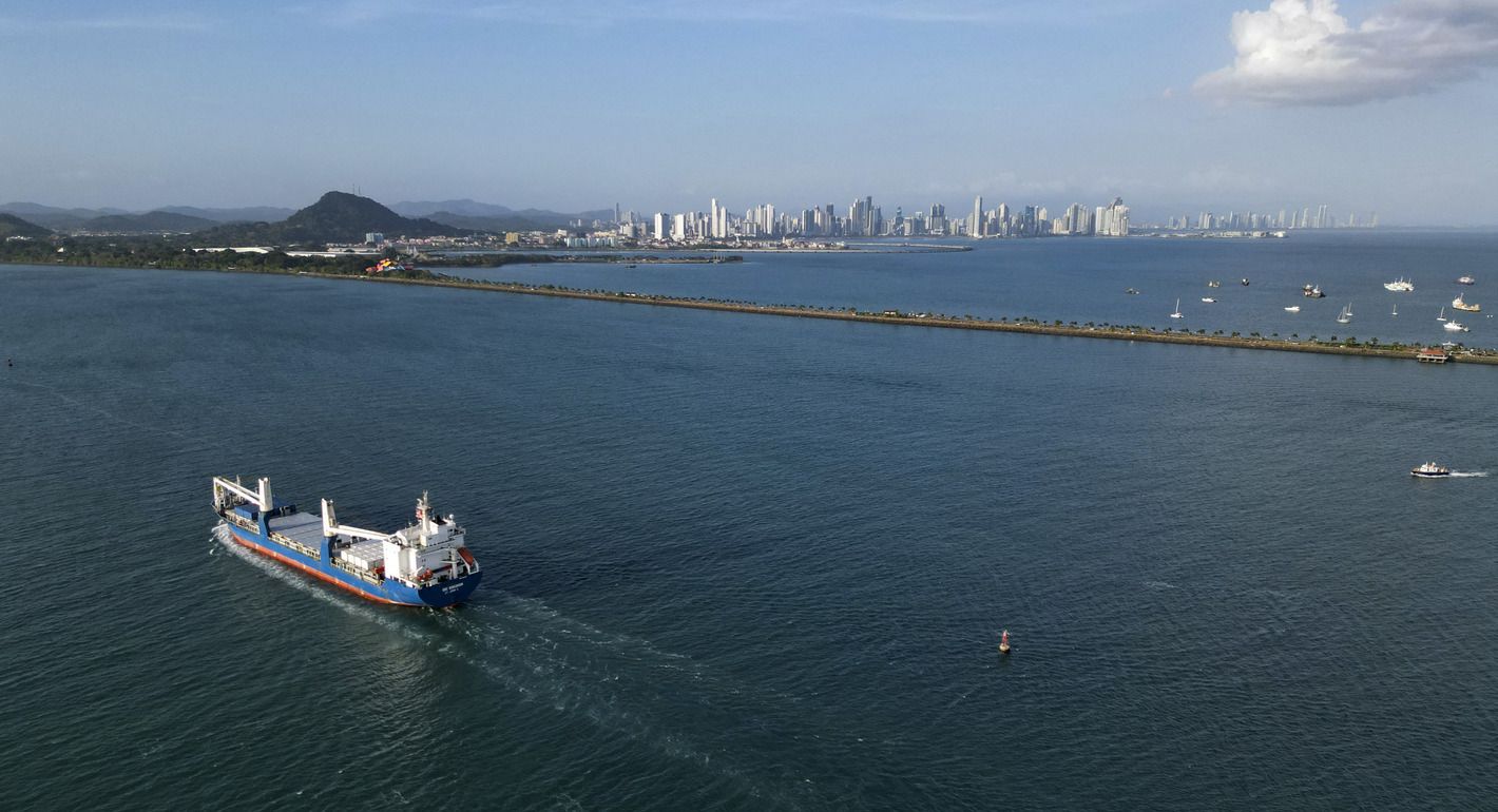 Photo of a cargo ship passing through the Panama Canal.