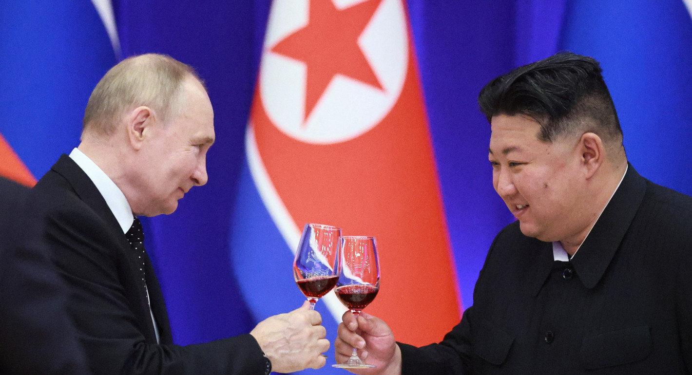 Putin and Kim toasting with glasses of red wine