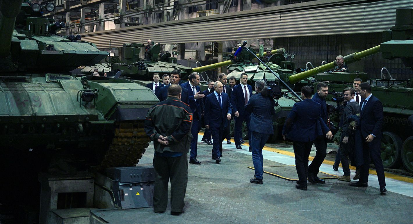 Putin walking in a military parade