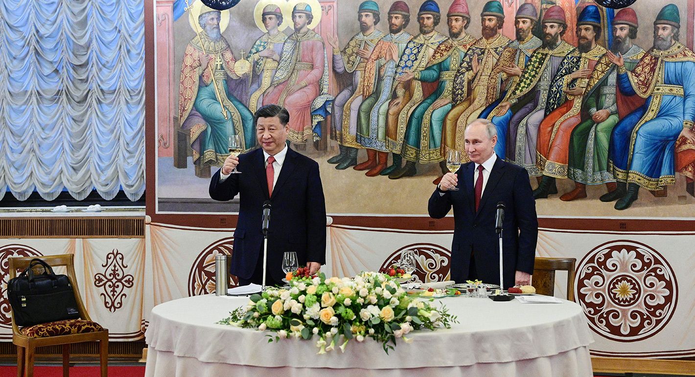 Russian President Vladimir Putin and China's President Xi Jinping hold glasses during a reception following their talks at the Kremlin in Moscow on March 21, 2023.