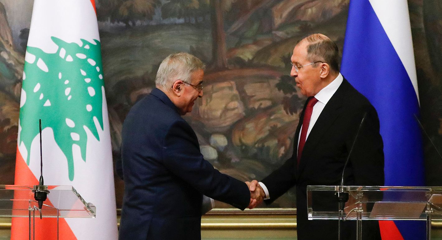 Russian Foreign Minister Sergei Lavrov (R) and his Lebanese counterpart Abdallah Bou Habib shake hands during a joint press conference following their talks in Moscow on November 22, 2021. 