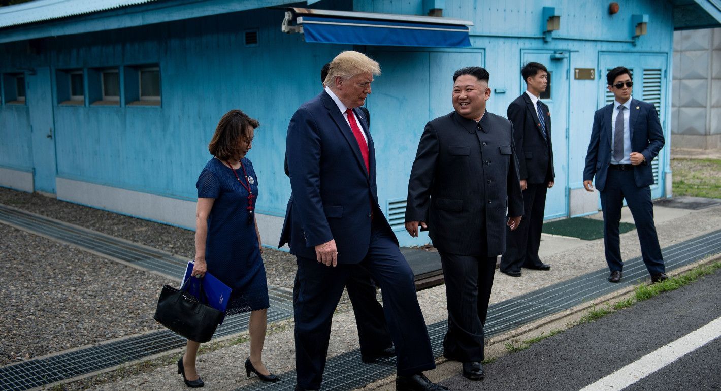 Trump and Kim walking and talking