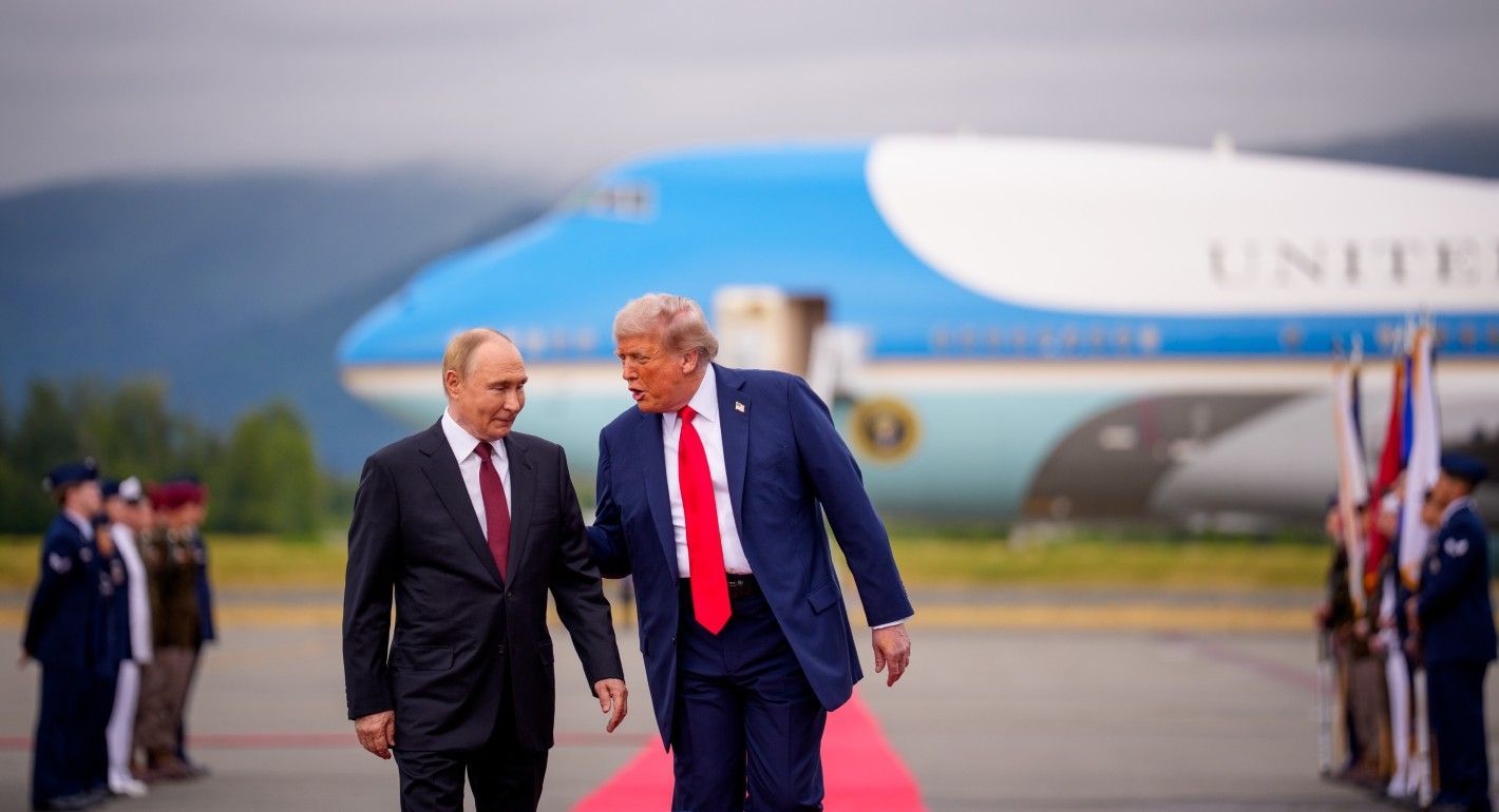 Trump and Putin greeting each other in front of Air Force One