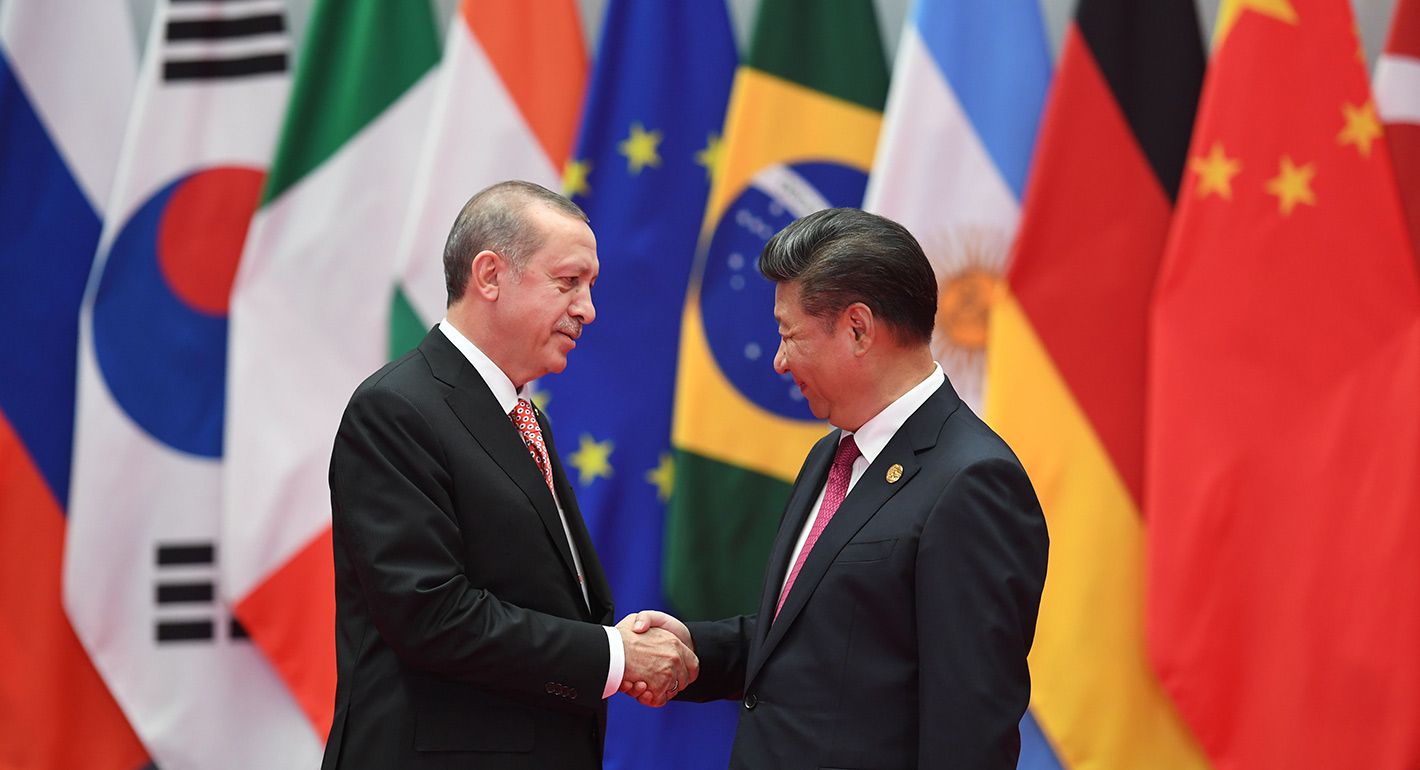 Turkey's President Recep Tayyip Erdogan is greeted by China's President Xi Jinping (R) before the G20 leaders' family photo in Hangzhou on September 4, 2016. 